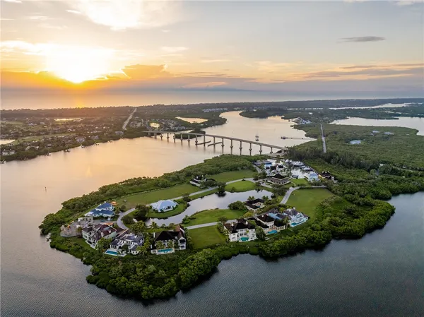 an aerial view of a house with a lake view