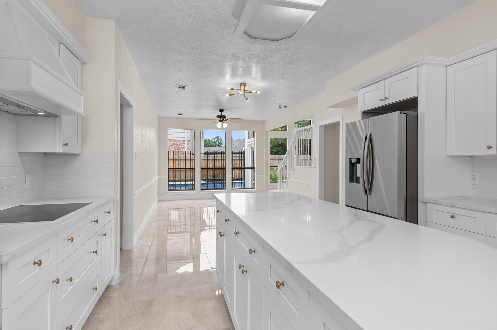 17402 Wilton Park Court Spring, TX 77379 - Photo 37 of 50 a large kitchen with cabinets and stainless steel appliances