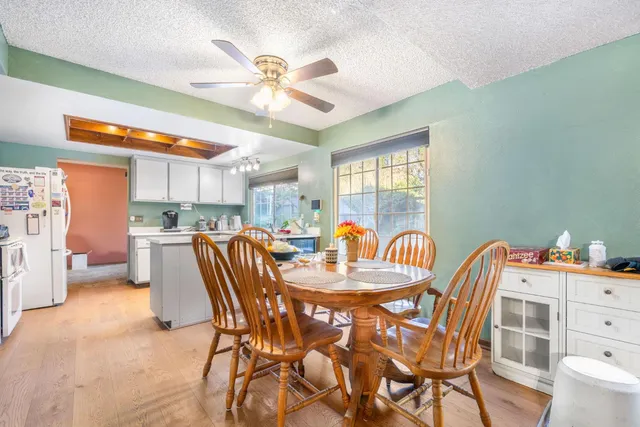 a dining room with furniture and window