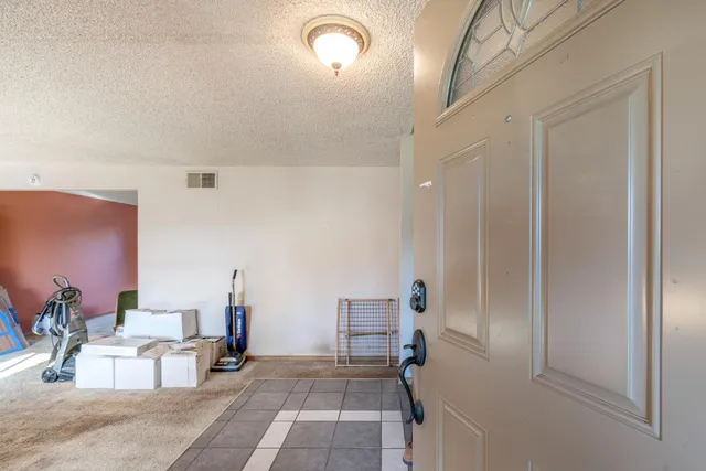 a view of a livingroom with natural light