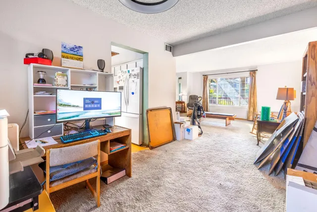 a bedroom with furniture and a book shelf