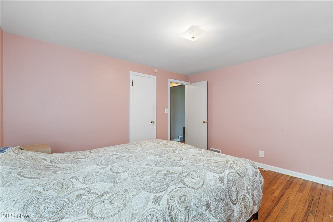 1527 Ridge Road Northwest Canton, OH 44703 - Photo 15 of 27 Bedroom featuring hardwood / wood-style flooring