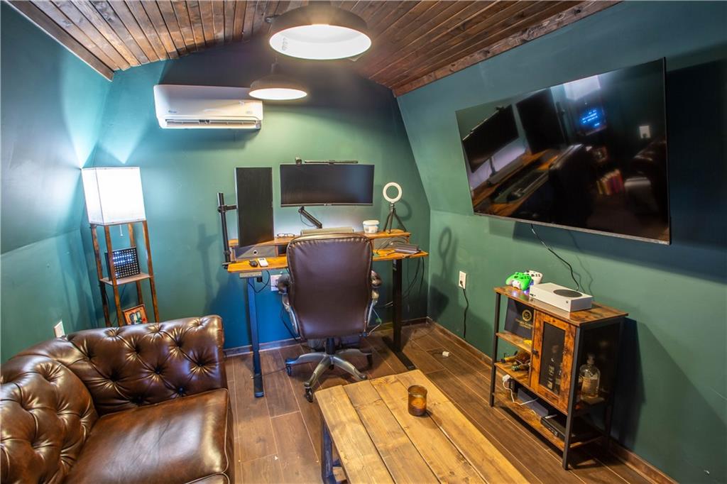 5215 Dixie Lake Road Union City, GA 30291 - Photo 11 of 12 a room with furniture and a flat screen tv