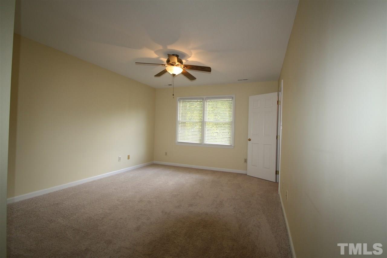 11924 Radner Way Raleigh, NC 27613 - Photo 15 of 25 a view of room with a ceiling fan and window