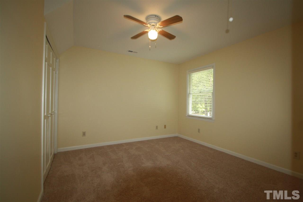 11924 Radner Way Raleigh, NC 27613 - Photo 18 of 25 an empty room with a window and a fan