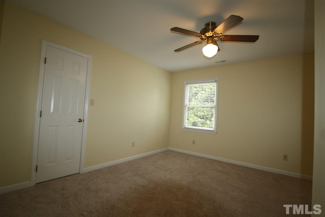 11924 Radner Way Raleigh, NC 27613 - Photo 19 of 25 a view of an empty room with a window