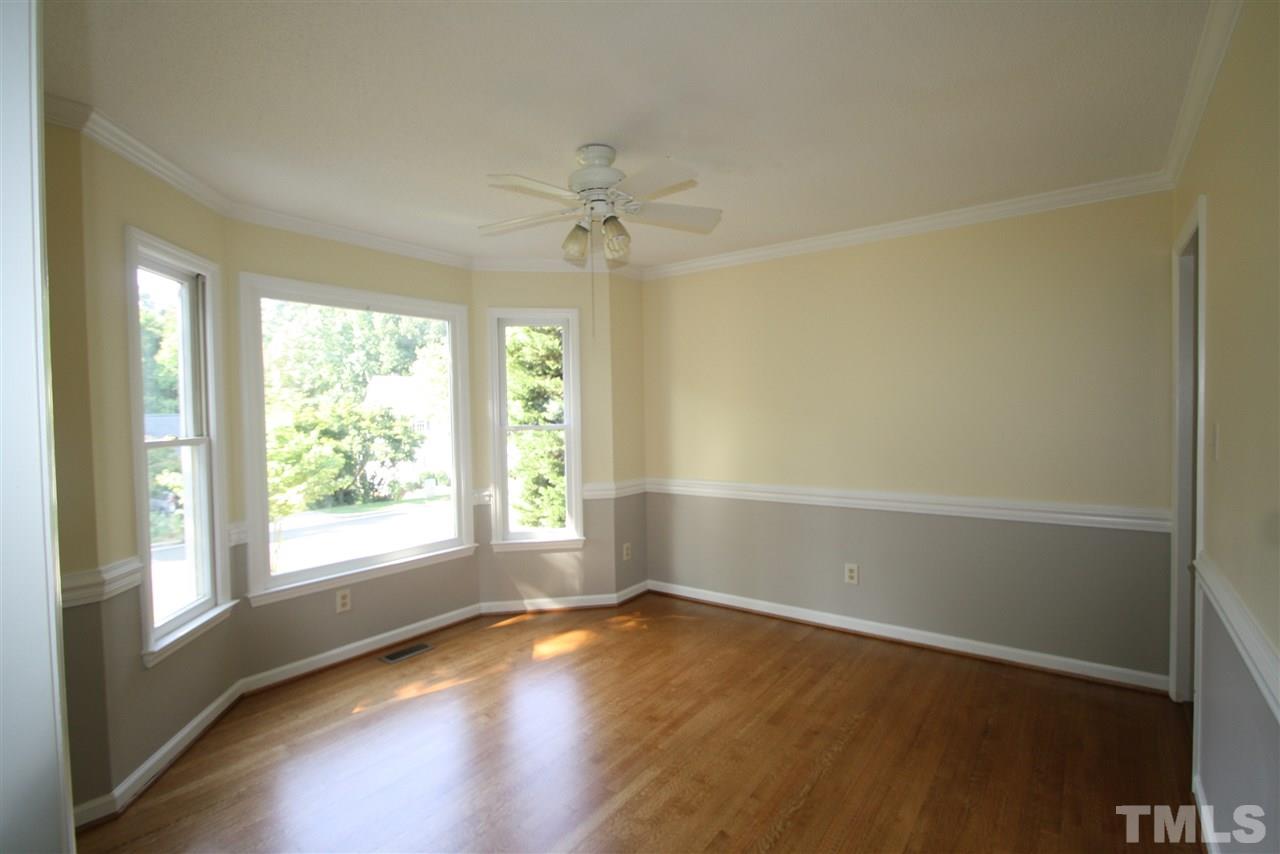 11924 Radner Way Raleigh, NC 27613 - Photo 9 of 25 an empty room with wooden floor and windows