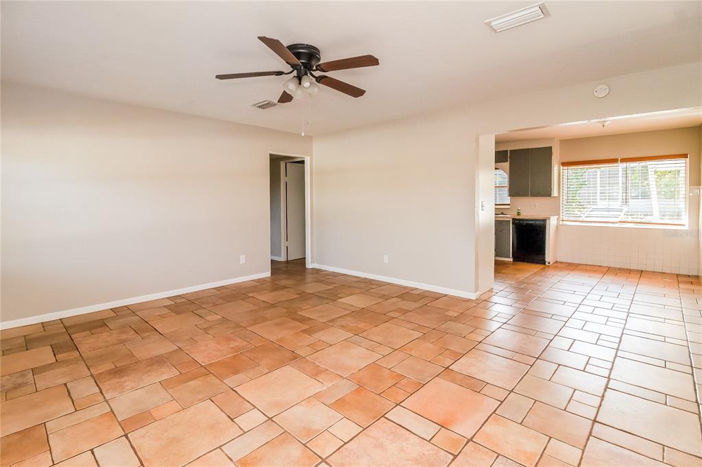 1197 West Lakeview Circle Altamonte Springs, FL 32714 - Photo 2 of 16 a view of a livingroom with a ceiling fan and window