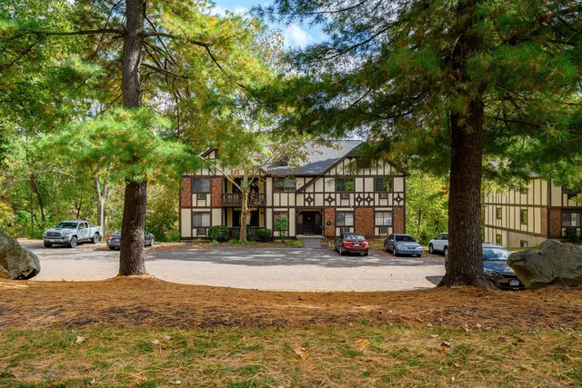 a view of street with parked cars