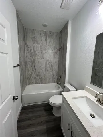 a view of a livingroom with wooden floor