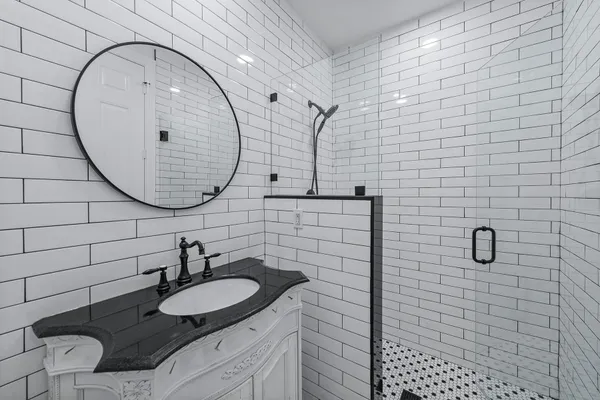 a bathroom with a sink and a mirror