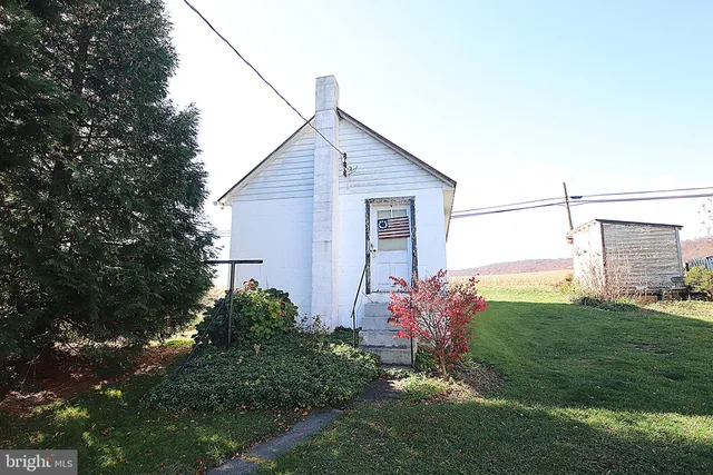 a backyard of a house with lots of green space