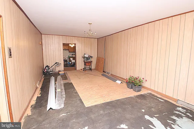 an entryway with a lot of white walls