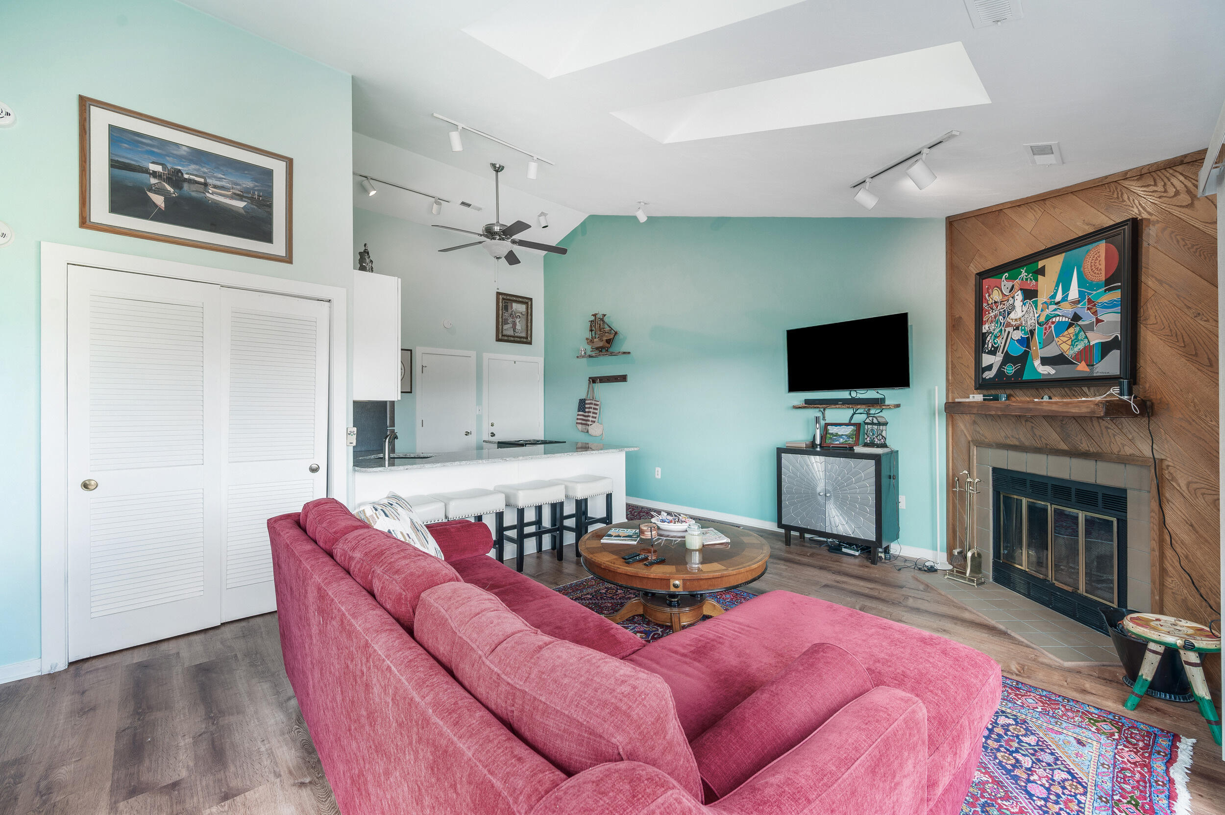 150 Sailor's Cove Drive, Unit 1218 Moneta, VA 24121 - Photo 14 of 56 a living room with furniture a flat screen tv and a fireplace