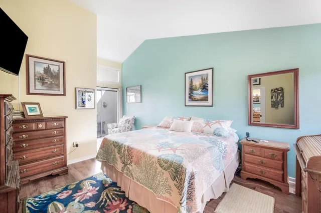 a bathroom with a granite countertop toilet sink and mirror