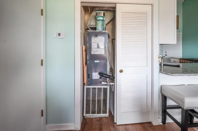 a view of a balcony with wooden floor & fence