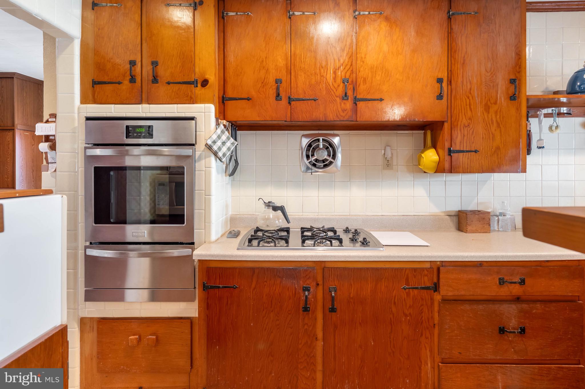 31266 River Road Millsboro, DE 19966 - Photo 19 of 47 a kitchen with stainless steel appliances kitchen island granite countertop a sink and cabinets