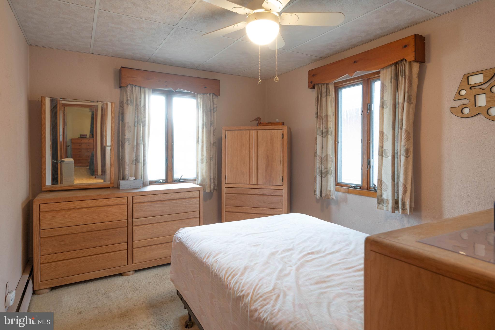 31266 River Road Millsboro, DE 19966 - Photo 26 of 47 a bedroom with a bed and a window