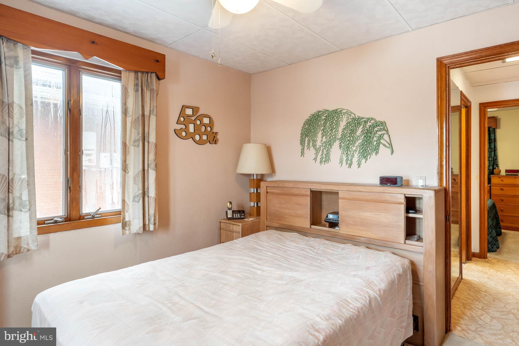 31266 River Road Millsboro, DE 19966 - Photo 27 of 47 a bedroom with a bed and a window