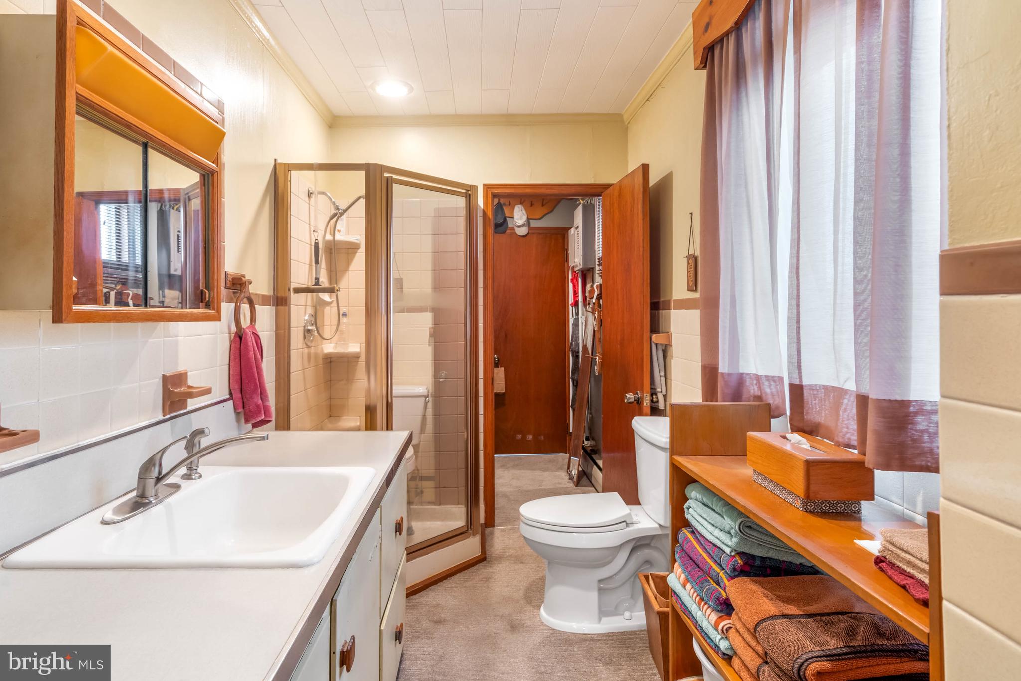 31266 River Road Millsboro, DE 19966 - Photo 31 of 47 a bathroom with a sink a toilet and tub