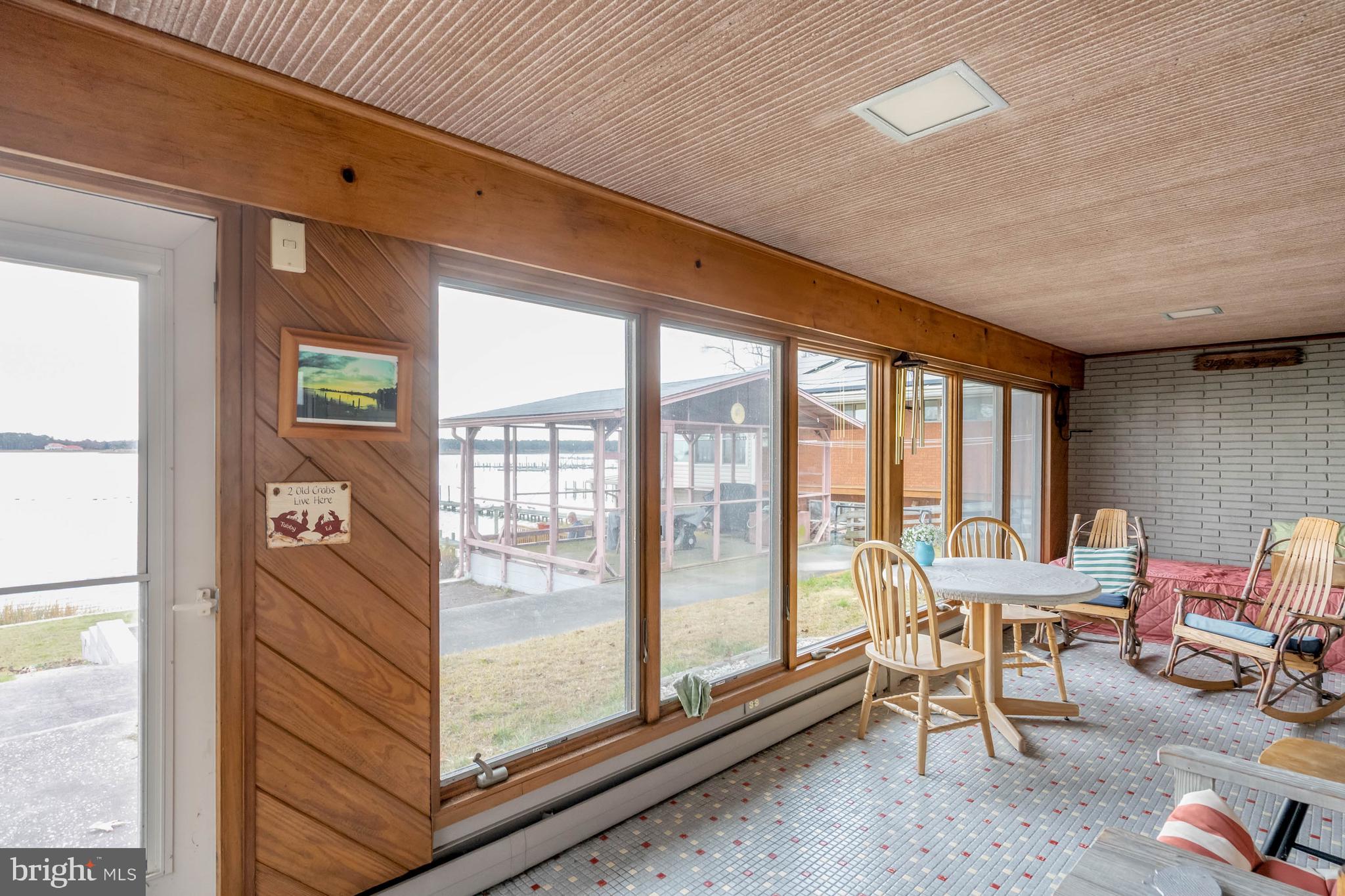 31266 River Road Millsboro, DE 19966 - Photo 33 of 47 a living room with furniture and a floor to ceiling window