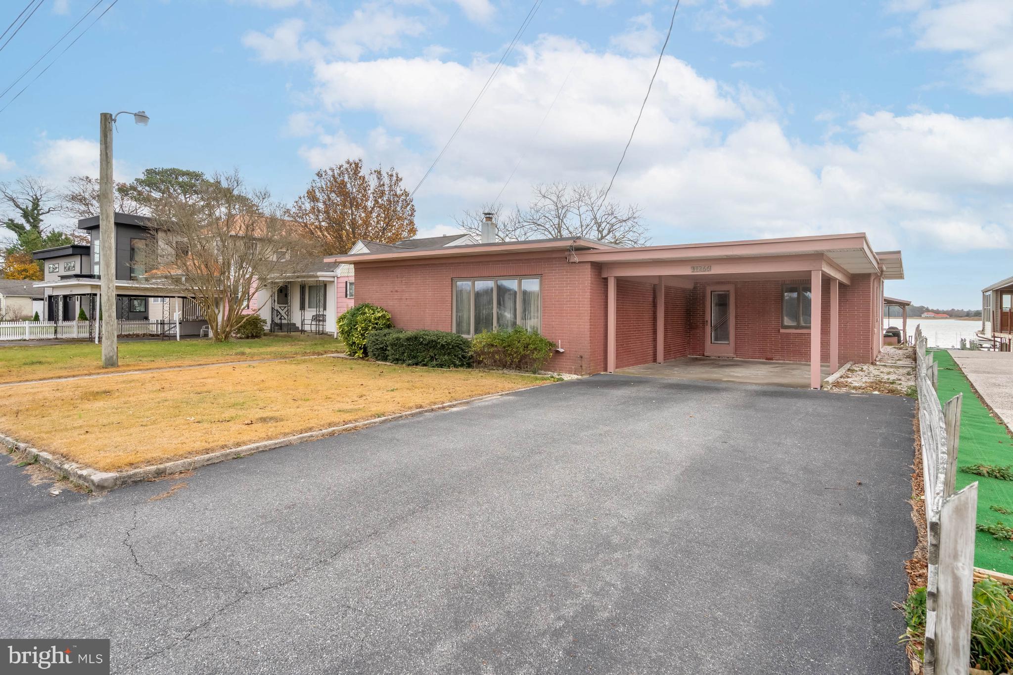 31266 River Road Millsboro, DE 19966 - Photo 35 of 47 a view of house with yard and barbeque oven