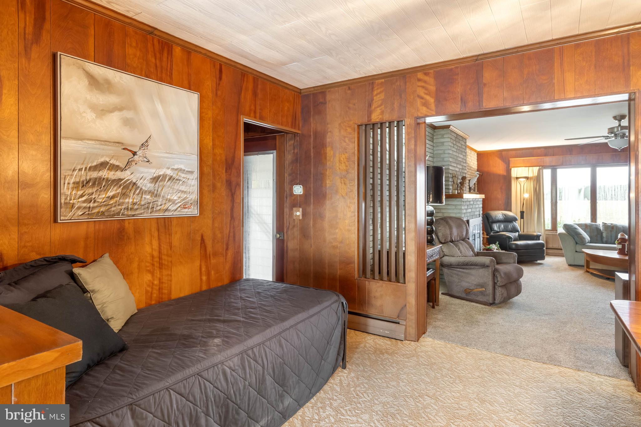 31266 River Road Millsboro, DE 19966 - Photo 4 of 47 a bedroom with furniture and large windows