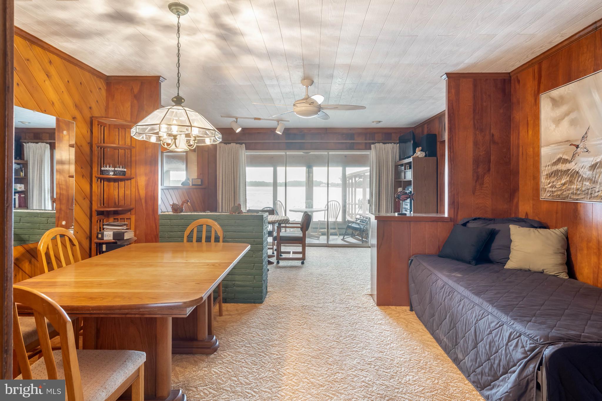 31266 River Road Millsboro, DE 19966 - Photo 5 of 47 a living room with furniture a chandelier and a chandelier