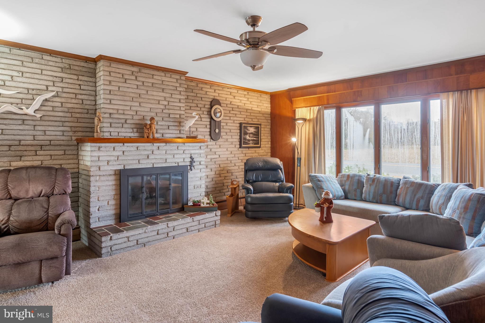 31266 River Road Millsboro, DE 19966 - Photo 8 of 47 a living room with furniture and a fireplace