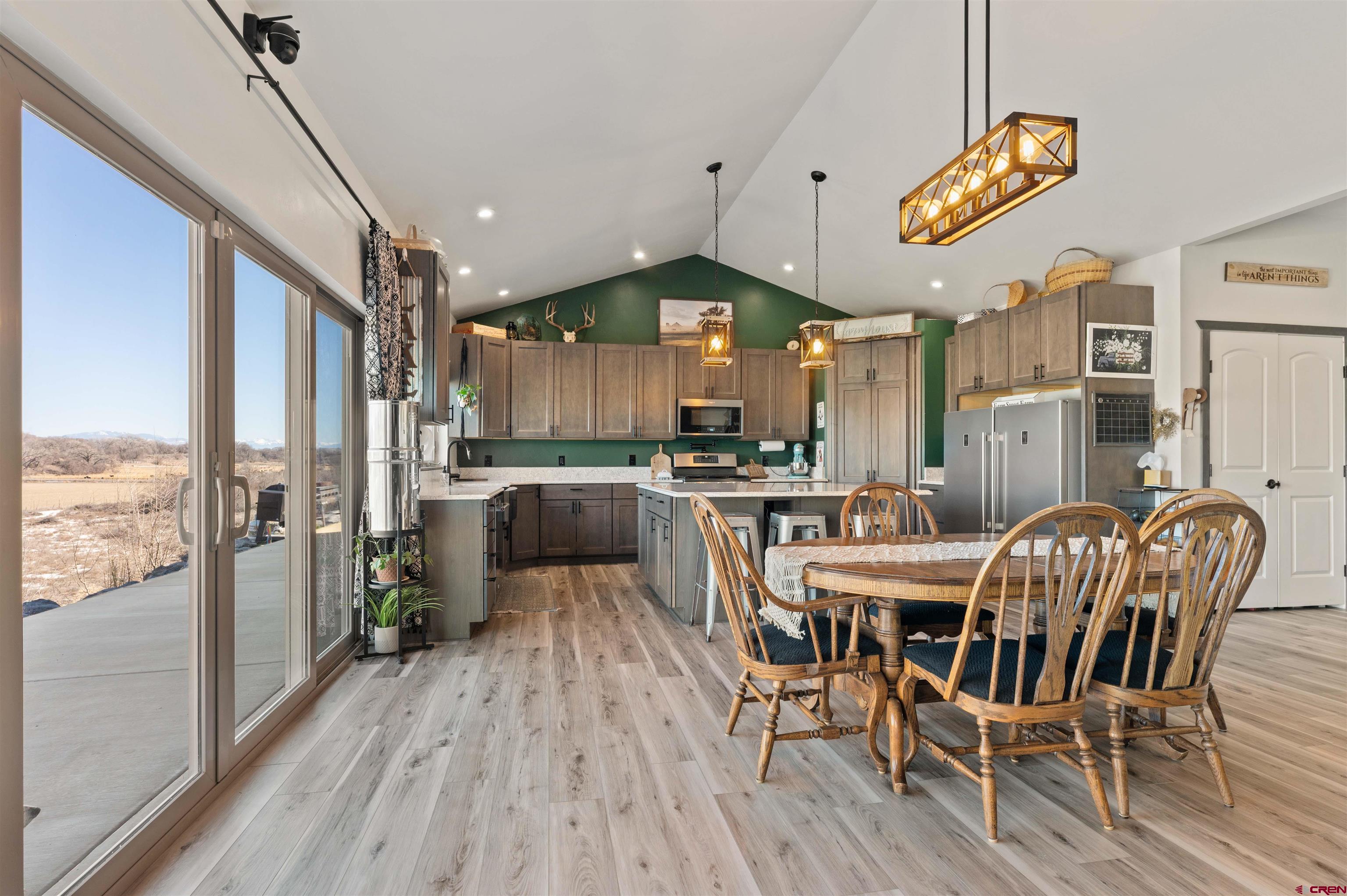 55347 Begonia Road Delta, CO 81416 - Photo 32 of 44 a view of a dining room with furniture window and wooden floor