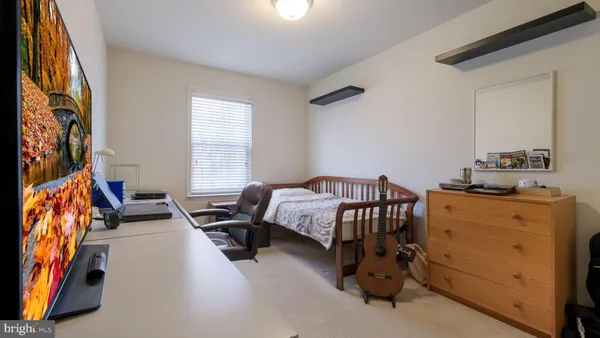 a bedroom with furniture and windows