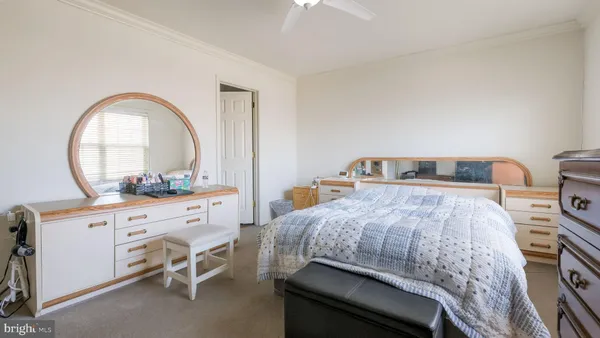 a bedroom with a bed and a dresser