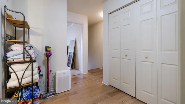 a view of an entryway with wooden floor