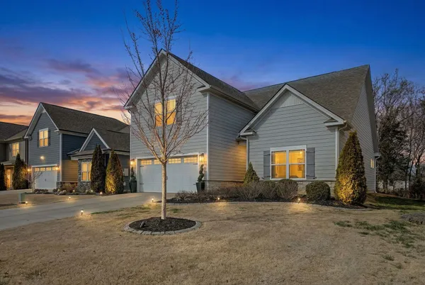 a front view of a house with a yard
