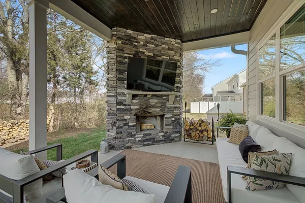 a living room with fireplace furniture and a flat screen tv