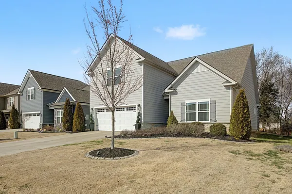 a front view of a house with a yard