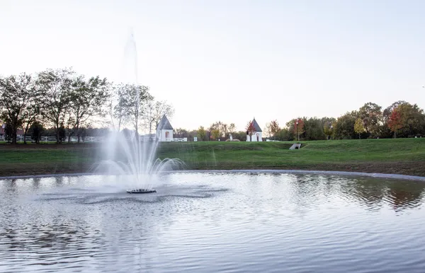 a view of a lake view with a fountain