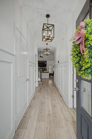 a view of a hallway view with wooden floor