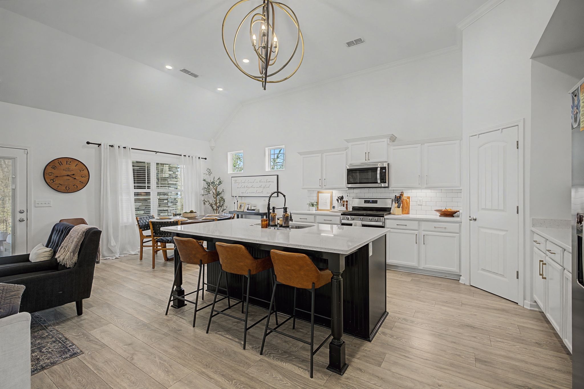 5310 Pointer Place Murfreesboro, TN 37129 - Photo 9 of 40 a kitchen with a dining table chairs and a refrigerator