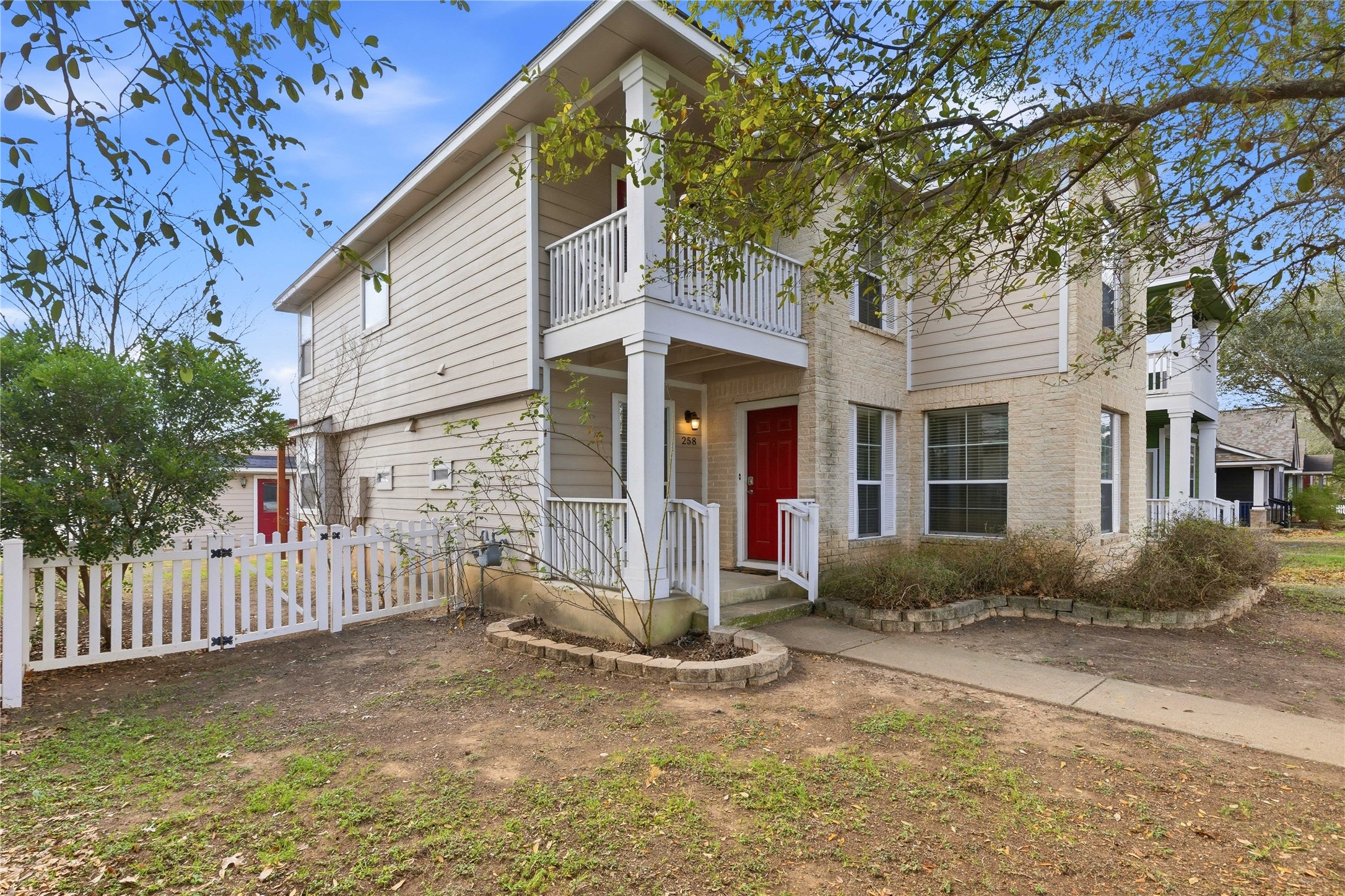 258 Hogan Kyle, TX 78640 - Photo 1 of 40 a front view of a house with a yard