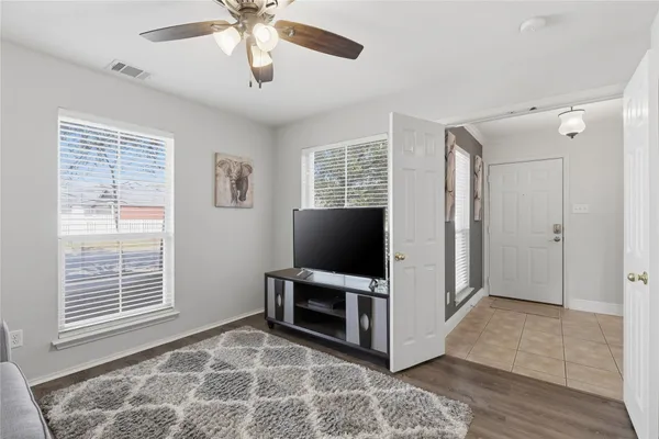 a view of livingroom with furniture flat screen tv and a window
