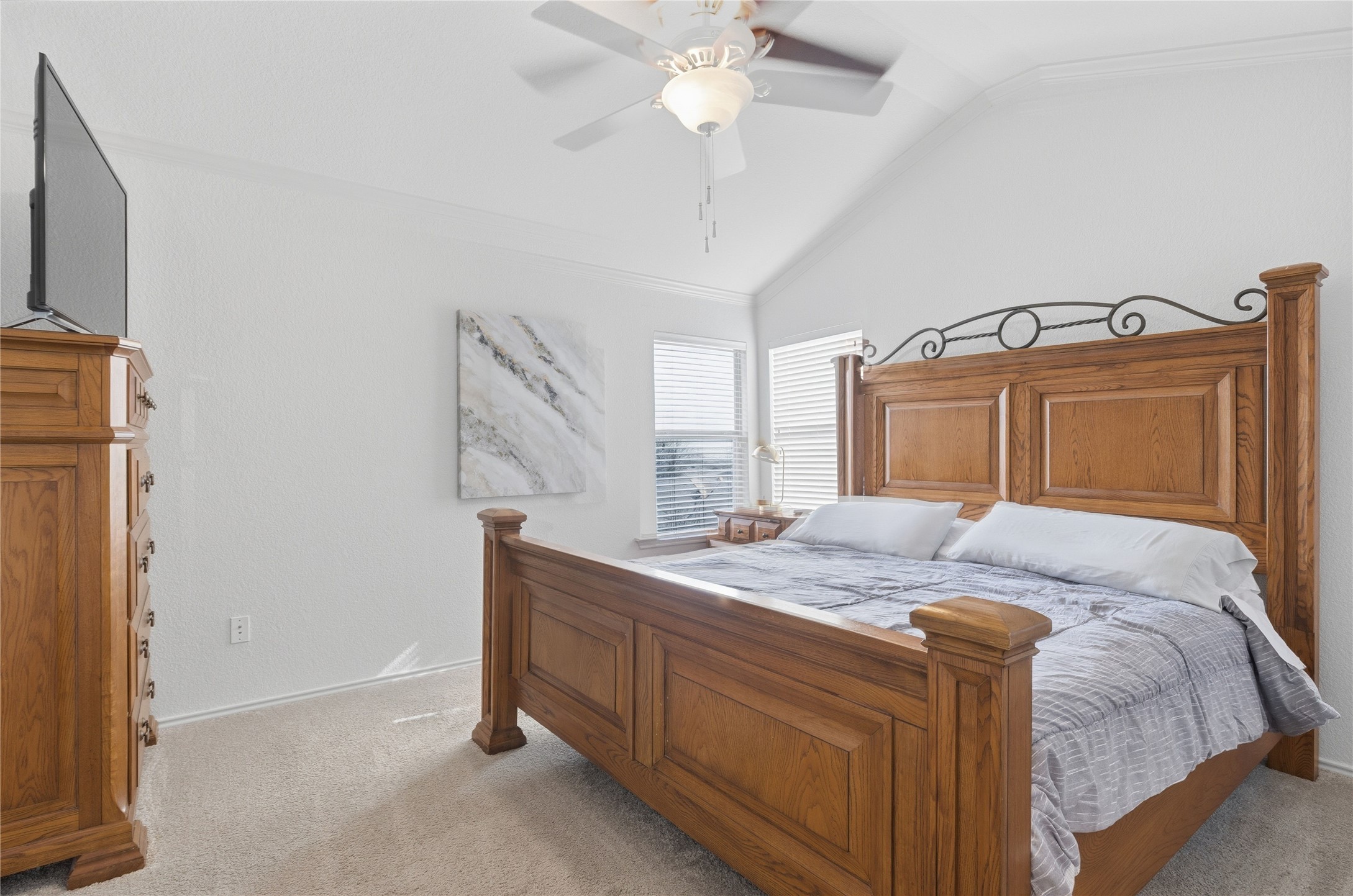 258 Hogan Kyle, TX 78640 - Photo 20 of 40 a bedroom with a bed and a chandelier