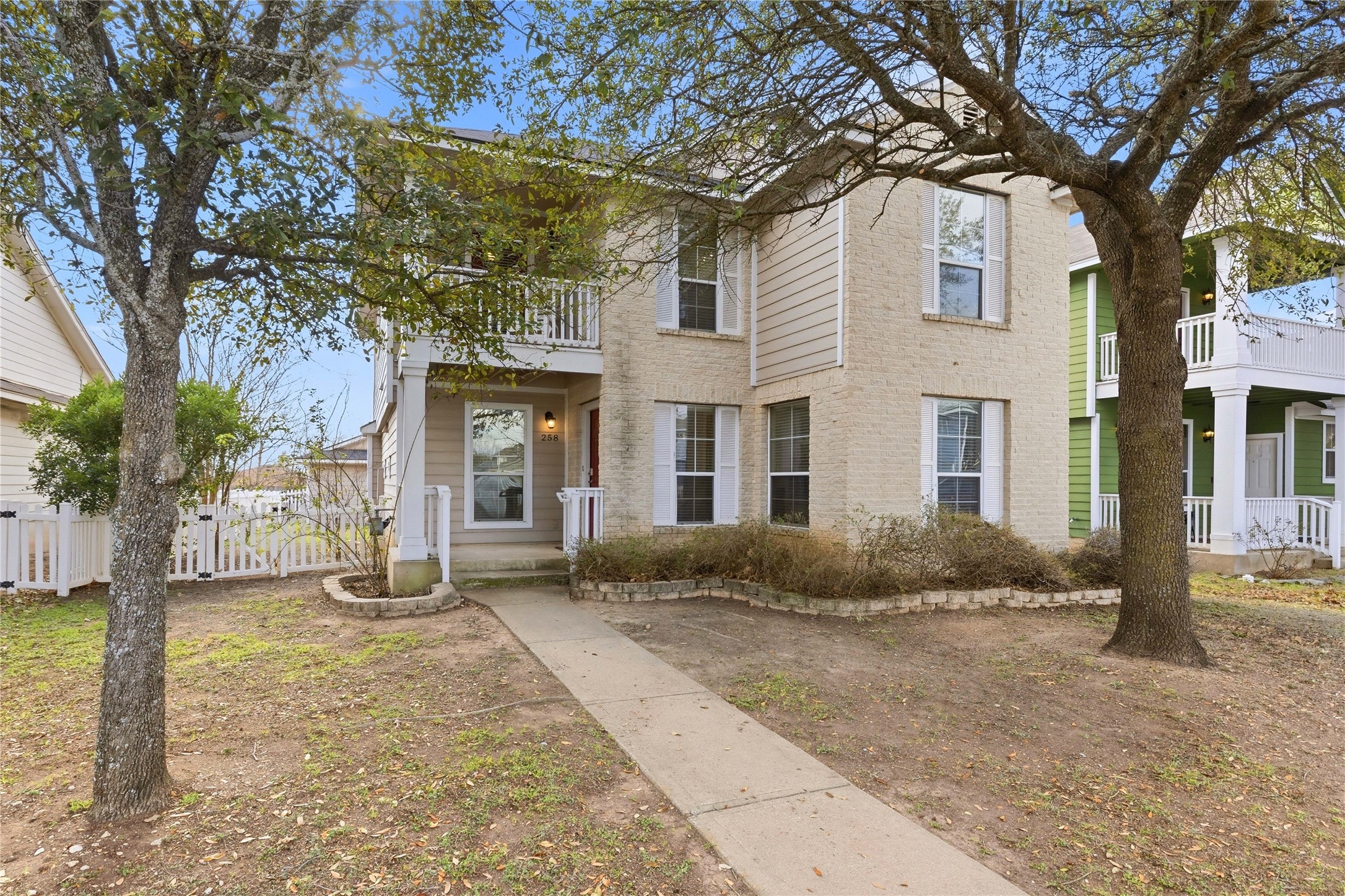 258 Hogan Kyle, TX 78640 - Photo 35 of 40 a front view of a house with a yard and potted plants