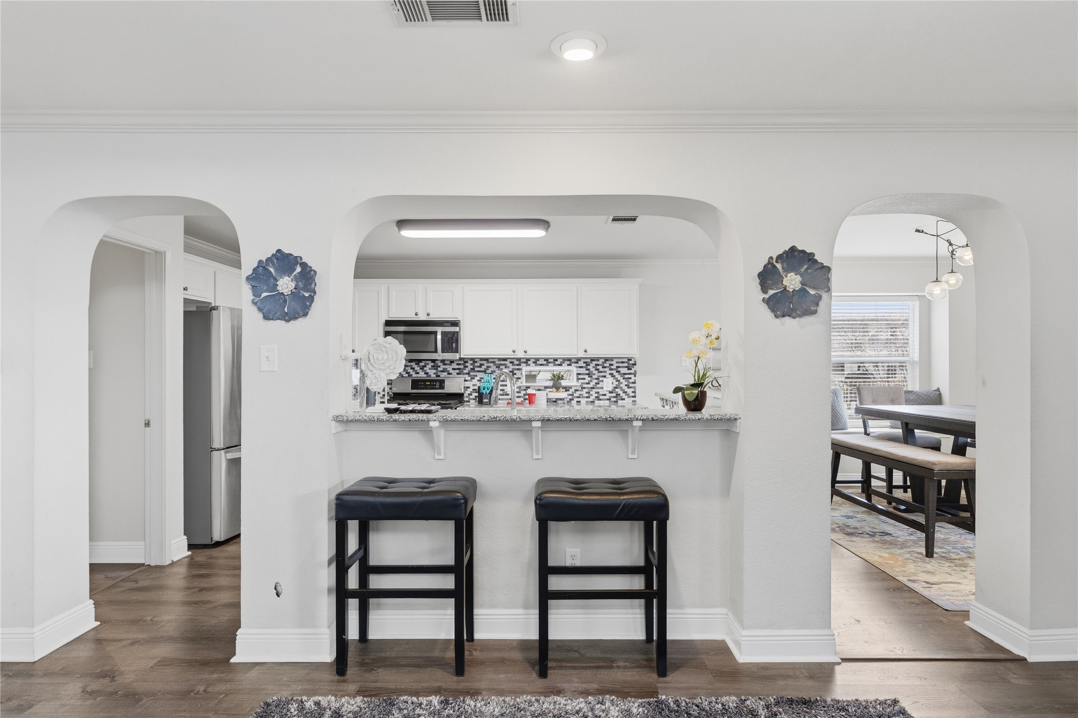 258 Hogan Kyle, TX 78640 - Photo 4 of 40 a kitchen with stainless steel appliances granite countertop a sink and cabinets