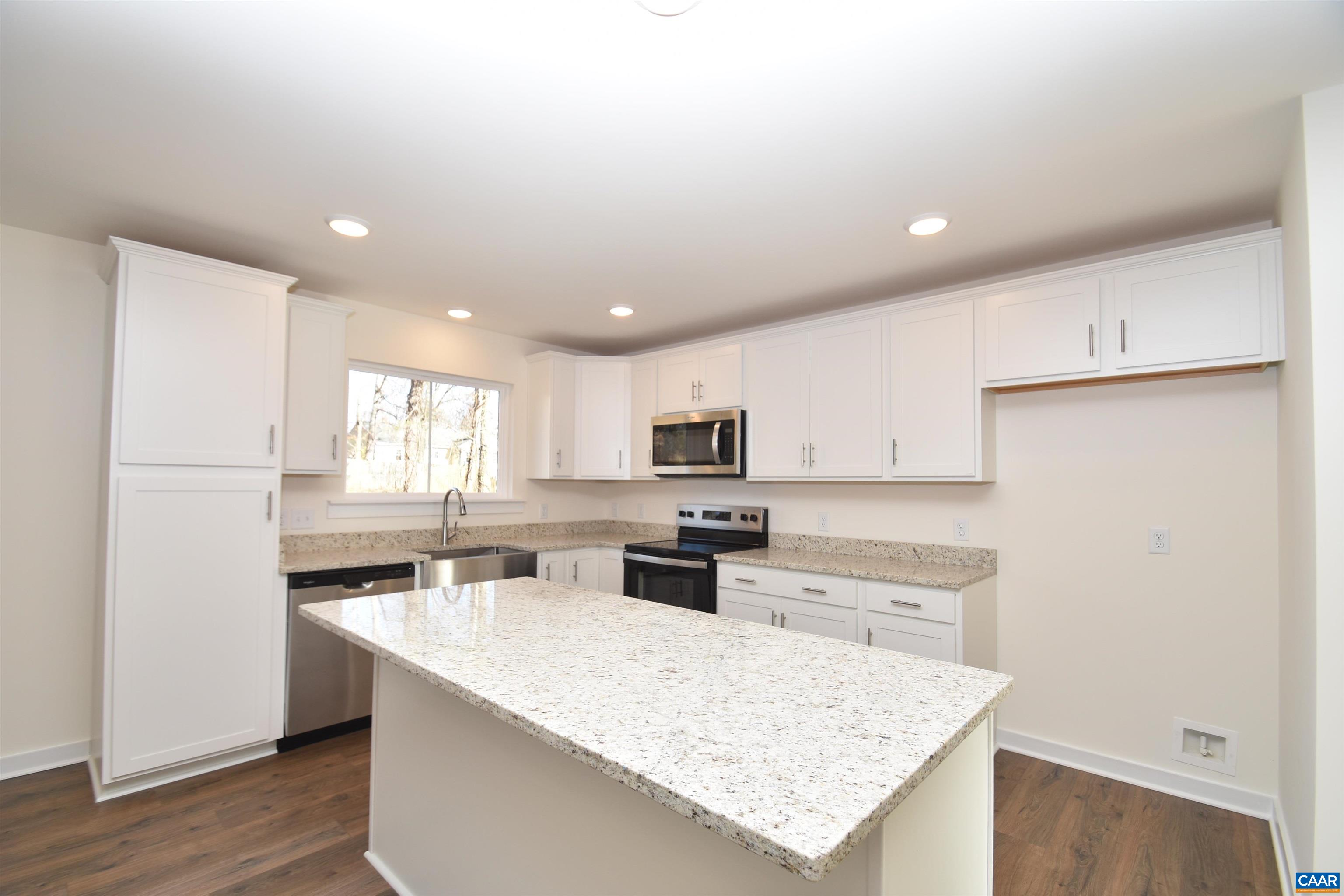 Lot4 Kidds Dairy Road, Unit KD4 Scottsville, VA 24590 - Photo 3 of 26 a kitchen with a sink a stove a refrigerator and white cabinets