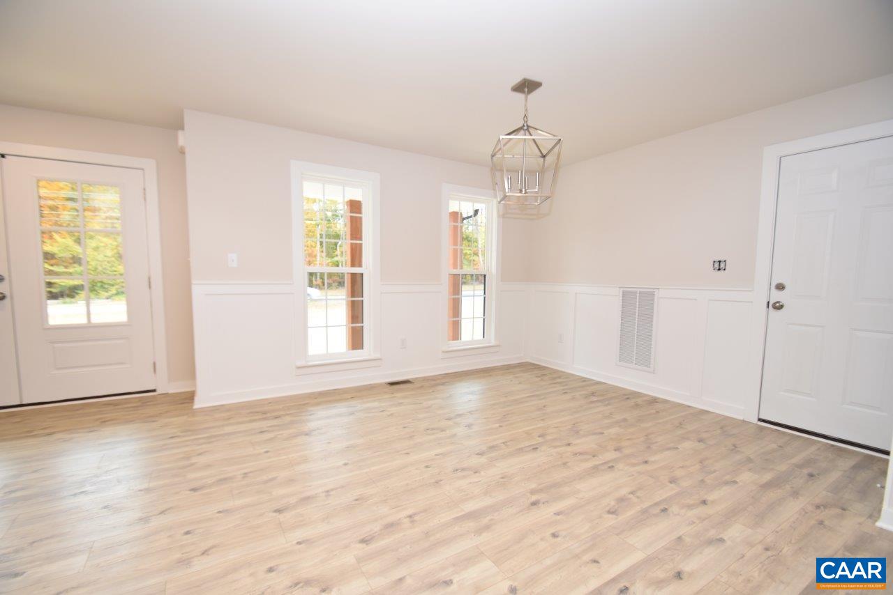 Lot4 Kidds Dairy Road, Unit KD4 Scottsville, VA 24590 - Photo 5 of 26 a view of an empty room with wooden floor and a window