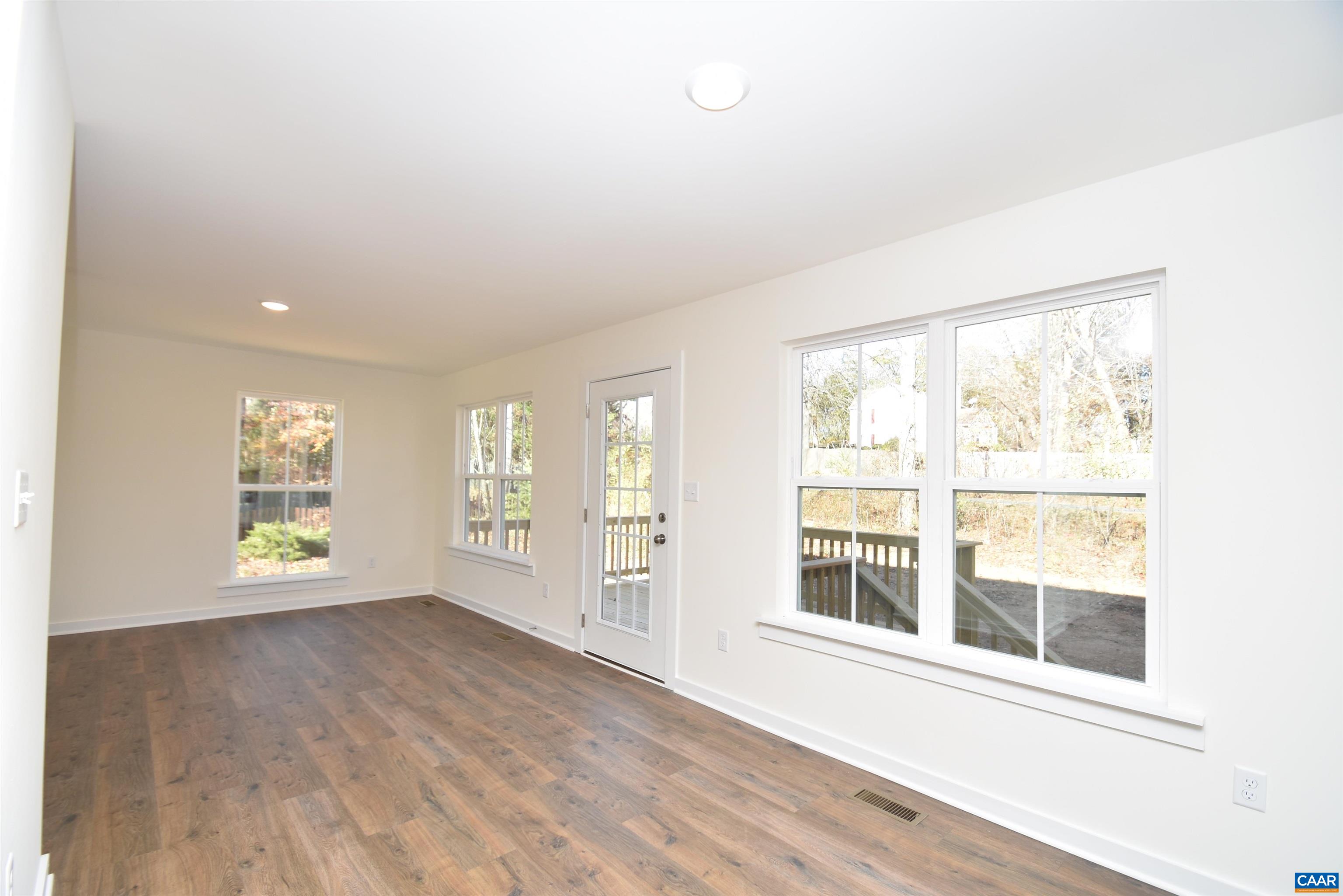 Lot4 Kidds Dairy Road, Unit KD4 Scottsville, VA 24590 - Photo 9 of 26 an empty room with wooden floor and windows