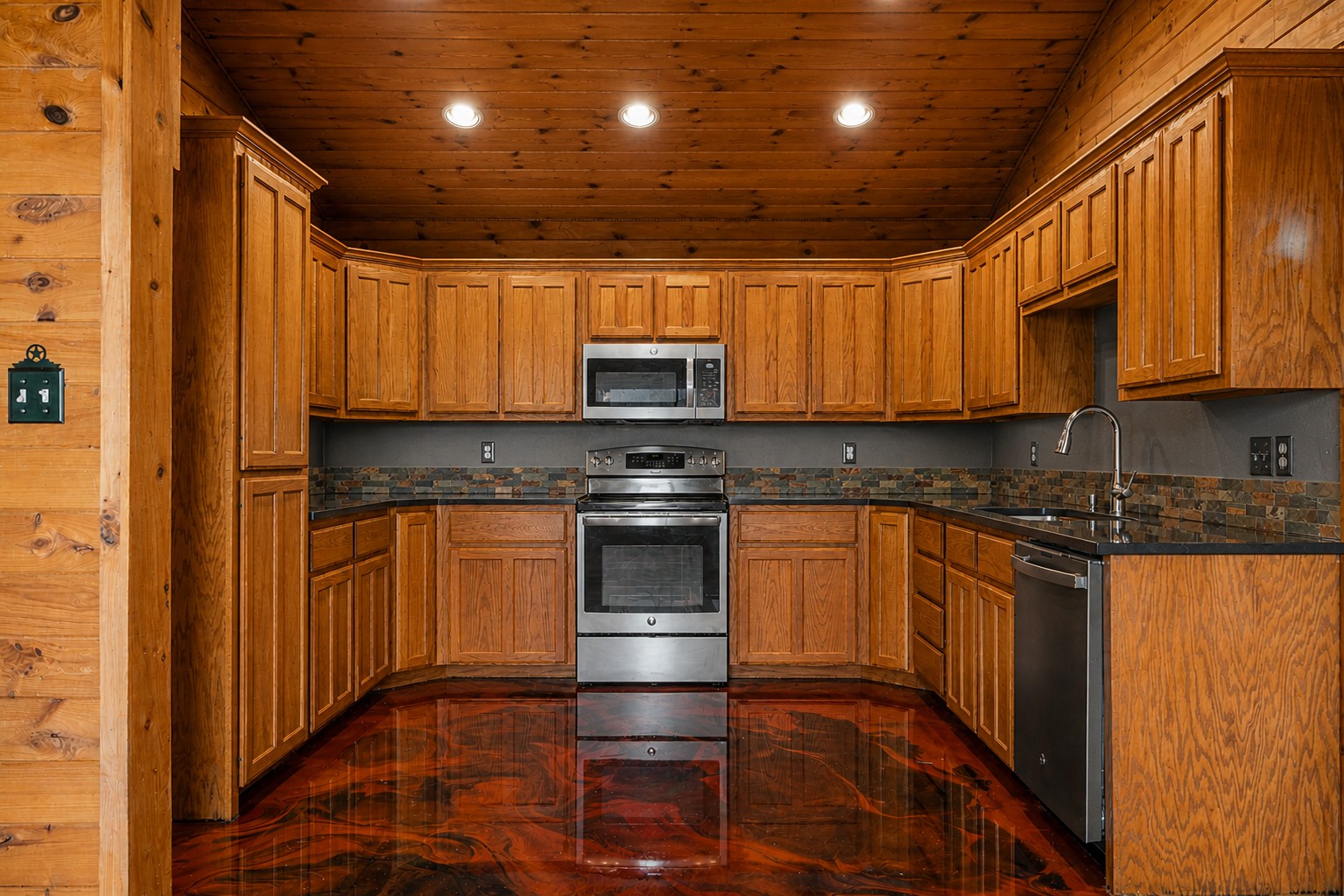800 County Road 126 Georgetown, TX 78626 - Photo 15 of 33 a kitchen with granite countertop a sink and stainless steel appliances