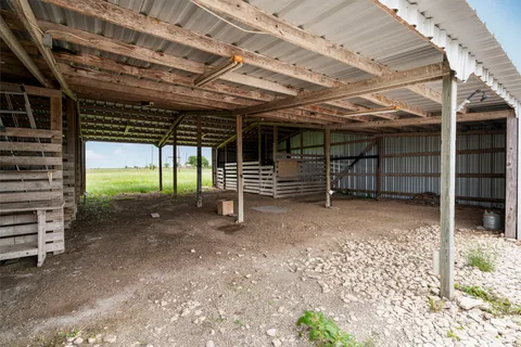 a view of a room with wooden walls