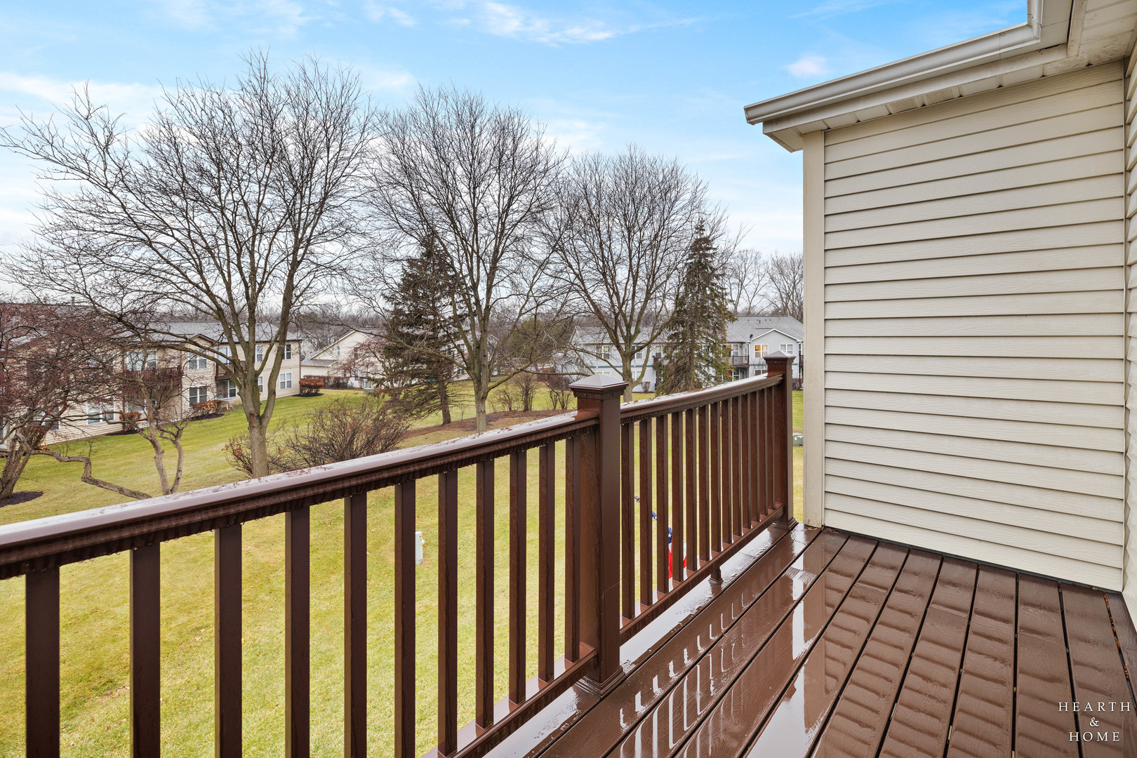 330 Buckingham Circle, Unit C Elgin, IL 60120 - Photo 3 of 21 a view of a balcony with wooden floor